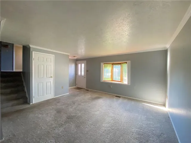 a view of empty room with windows