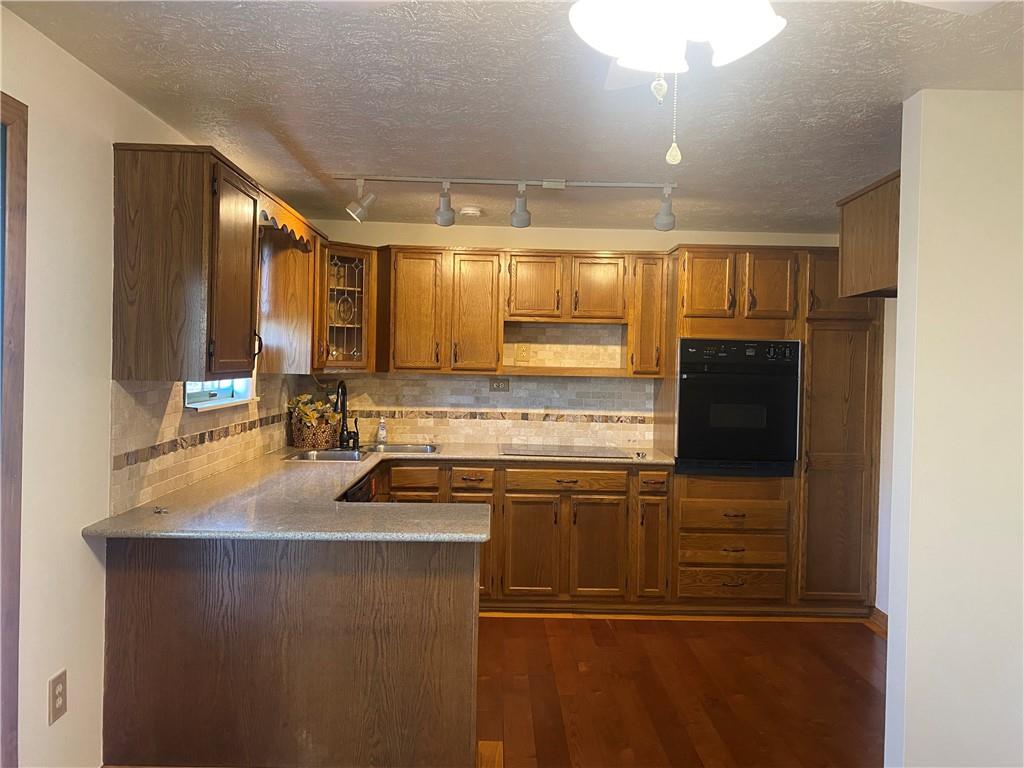 744 North Gross Street Conway, PA 15027 - Photo 6 of 29 a kitchen with kitchen island a sink stove and refrigerator