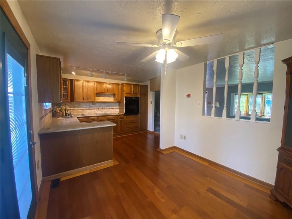 744 North Gross Street Conway, PA 15027 - Photo 7 of 29 a view of kitchen with granite countertop cabinets and refrigerator
