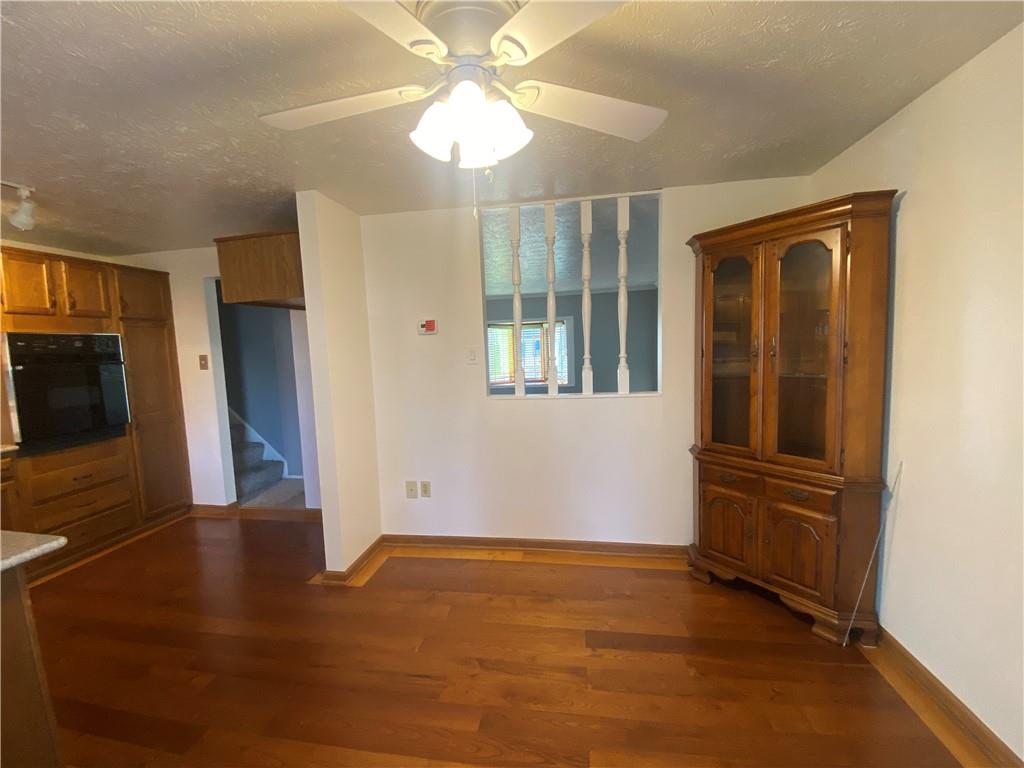 744 North Gross Street Conway, PA 15027 - Photo 8 of 29 wooden floor in an empty room with a window