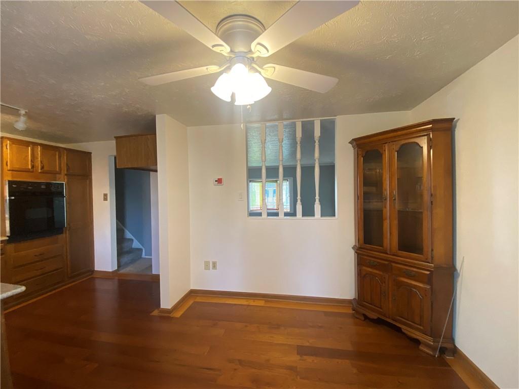 744 North Gross Street Conway, PA 15027 - Photo 9 of 29 a view of empty room with wooden floor and fan