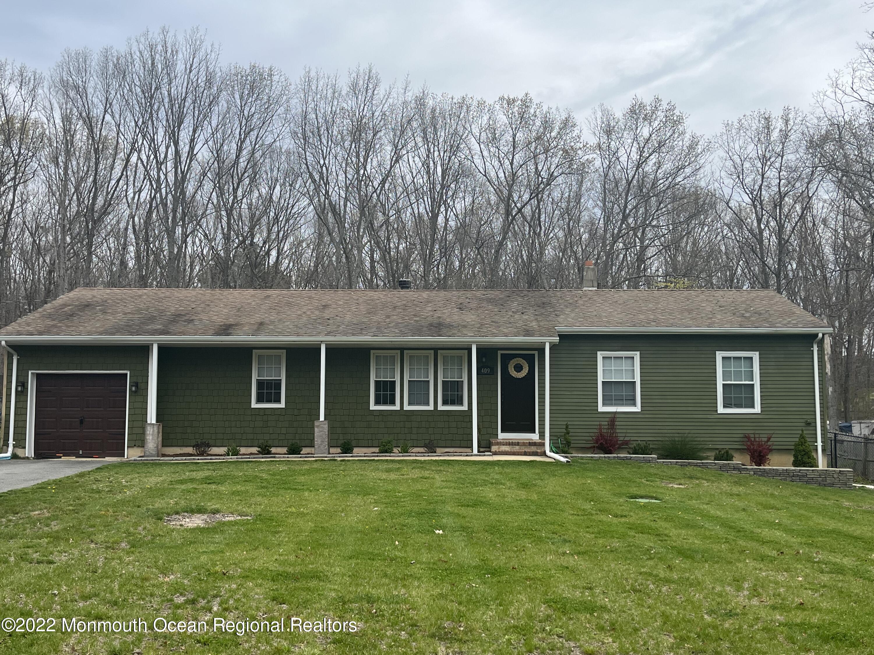 409 Leesville Road Jackson, NJ 08527 - Photo 54 of 54 a view of an house with backyard space and garden