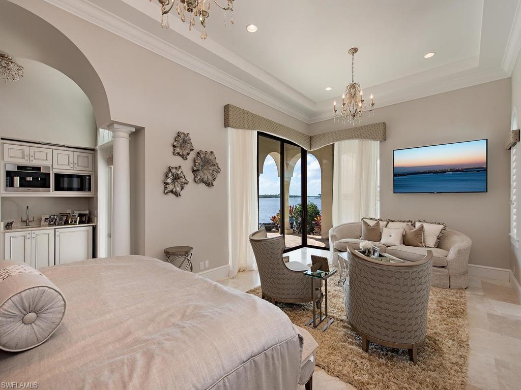 2615 Tarpon Road Naples, FL 34102 - Photo 12 of 20 a living room with furniture and a chandelier