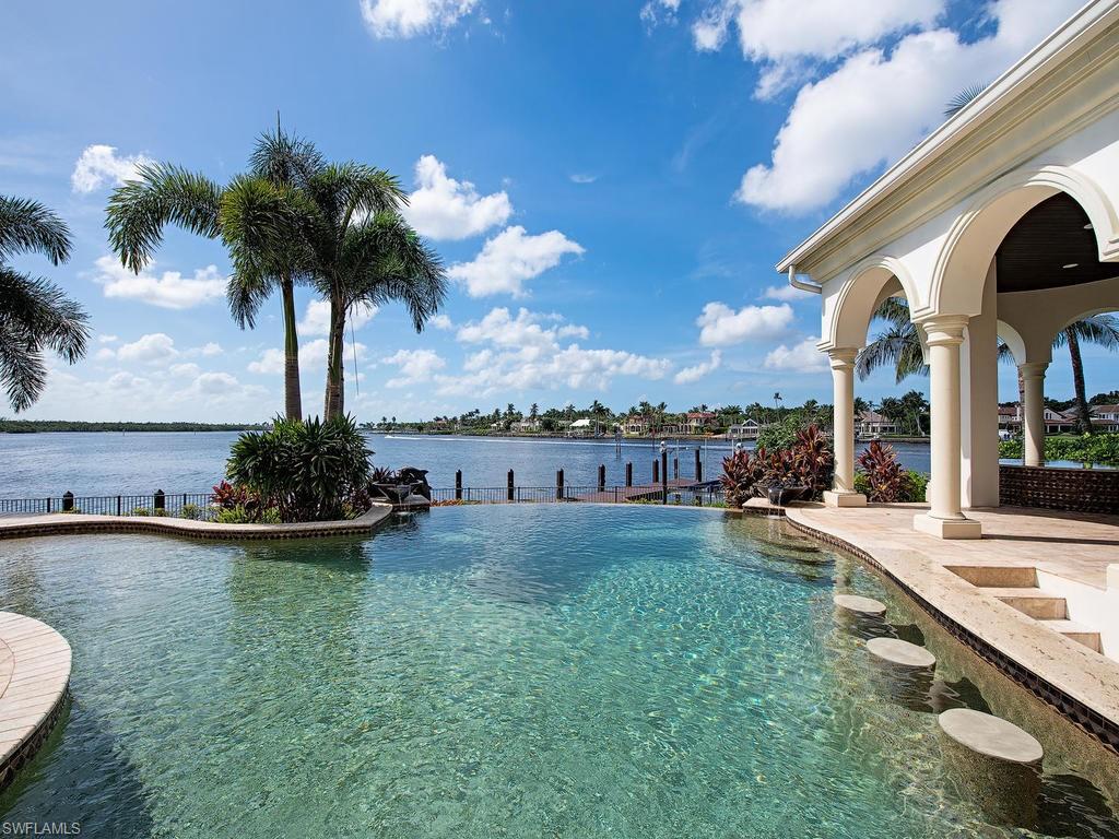 2615 Tarpon Road Naples, FL 34102 - Photo 18 of 20 a view of a swimming pool and lounge chair