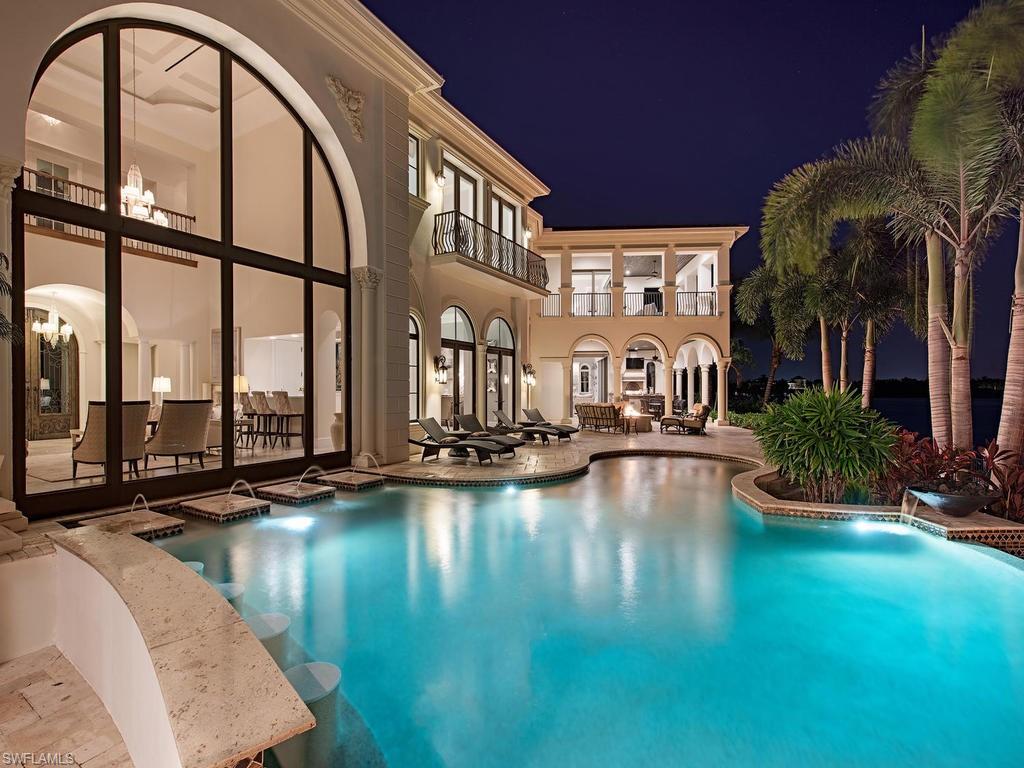 2615 Tarpon Road Naples, FL 34102 - Photo 20 of 20 a view of swimming pool with outdoor seating and lake view