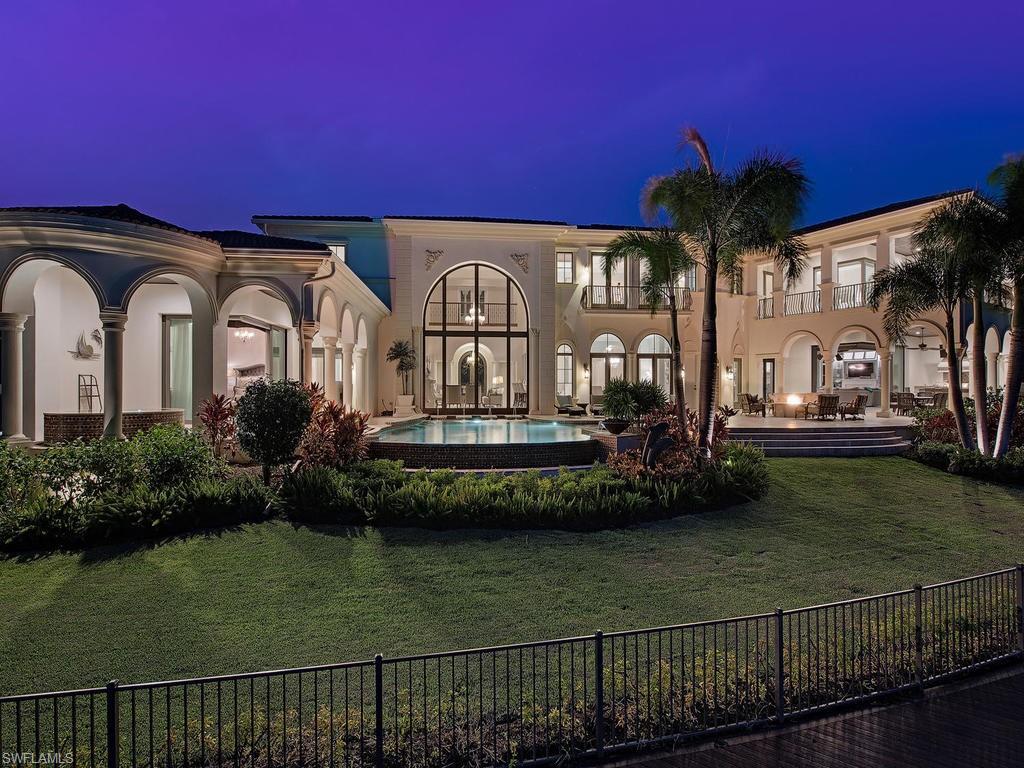 2615 Tarpon Road Naples, FL 34102 - Photo 3 of 20 a front view of a house with a garden