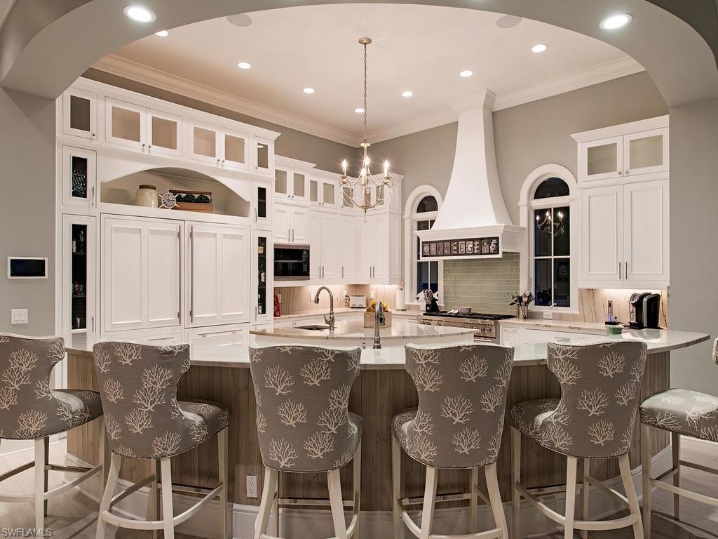 2615 Tarpon Road Naples, FL 34102 - Photo 7 of 20 a large kitchen with a table and chairs