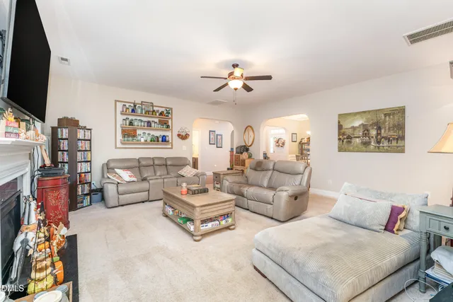 a kitchen with stainless steel appliances granite countertop a sink a stove and a wooden cabinets