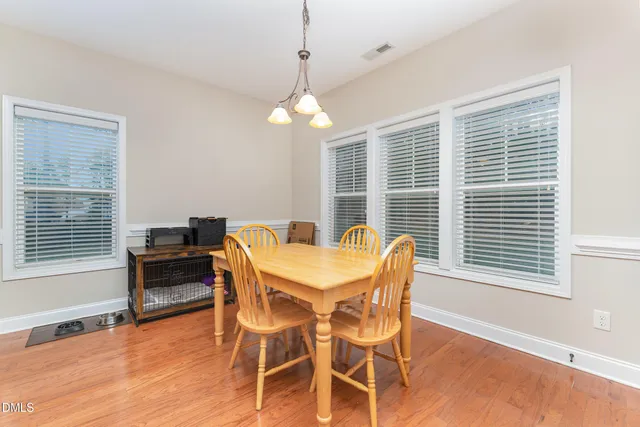 a kitchen with granite countertop a sink a stove and cabinets