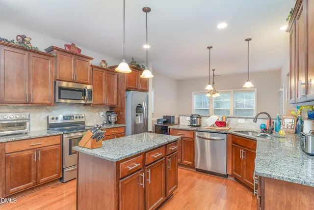a kitchen with granite countertop cabinets and outdoor view