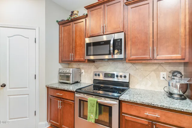 a bedroom with a bed and flat screen tv