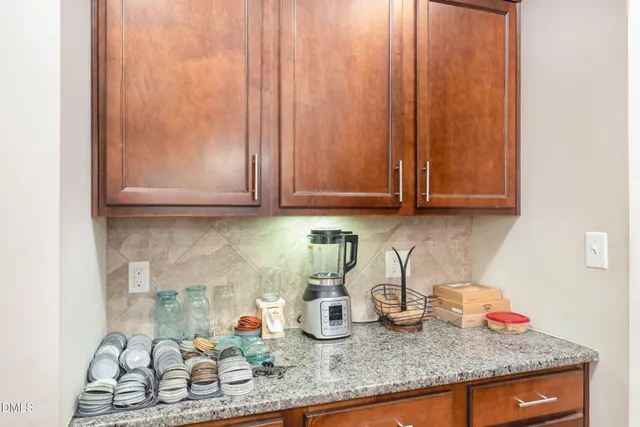 a bathroom with a sink vanity and a mirror