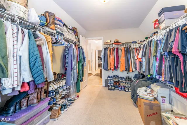 a bathroom with a sink a toilet a mirror and shower
