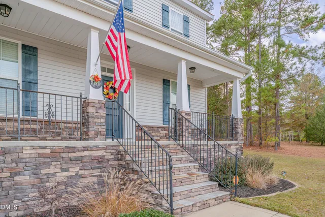 a front view of a house with large windows