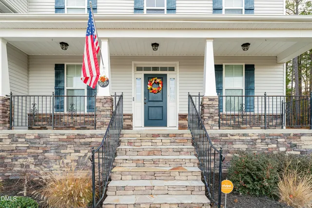 a front view of a house with large windows