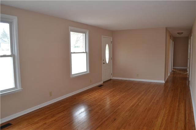 Hardwood floors extend throughout the main level of the home except where there is new tile in the Kitchen & Baths. New neutral paint throughout makes this home move-in ready to fit any decor!