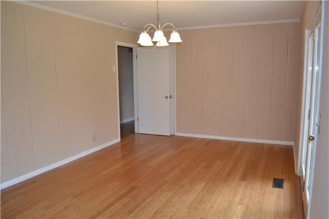 The Den has new laminate flooring that blends flawlessly with the original hardwood floors.  It also features crown mldg and a convenient game/storage closet.