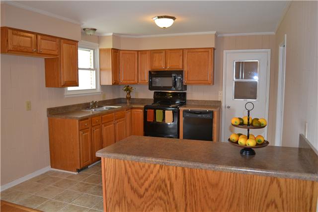 The Kitchen boasts all new cabinets w/a lazy susan in corner cabinet, new countertop, new bl appliances includ. blt-in micro, stove, & dishwasher and island.