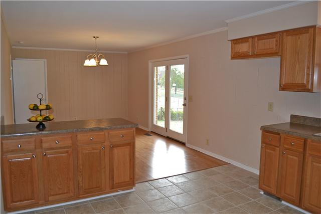 106 Chiroc Road Hendersonville, TN 37075 - Photo 9 of 20 The Kitchen is open to the Den with an abundance of light filtering in through the full view glass French Doors that open to the covered patio.