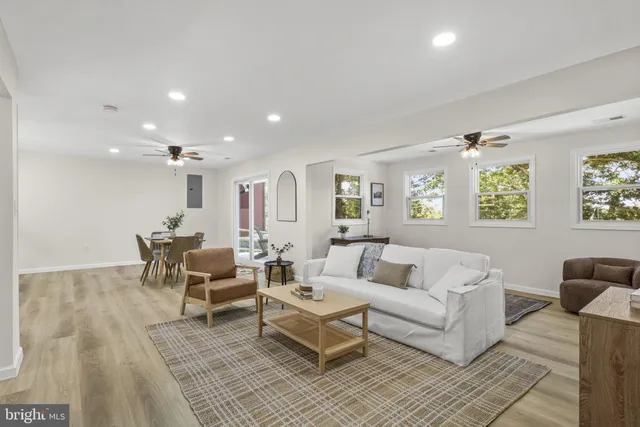 a living room with furniture and a table