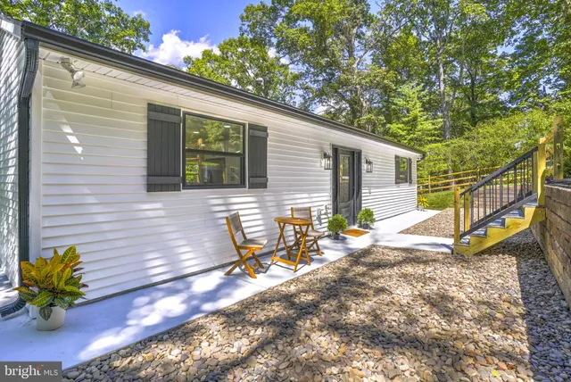 a aerial view of a house with a yard