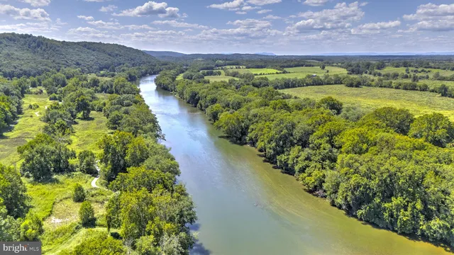 a view of a lake with a yard