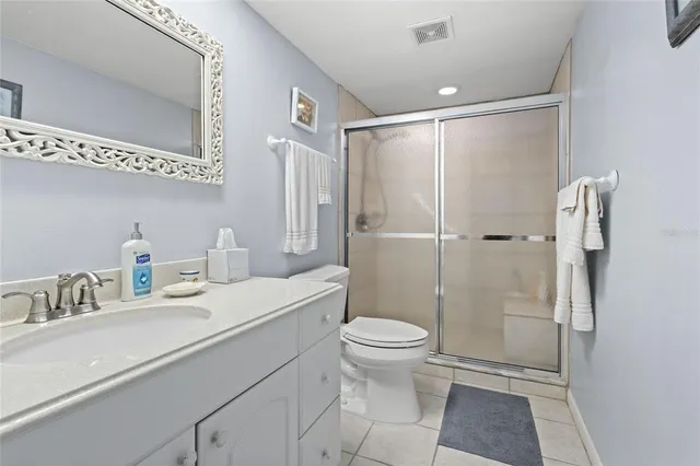 a bedroom that has a bed and a dresser in it