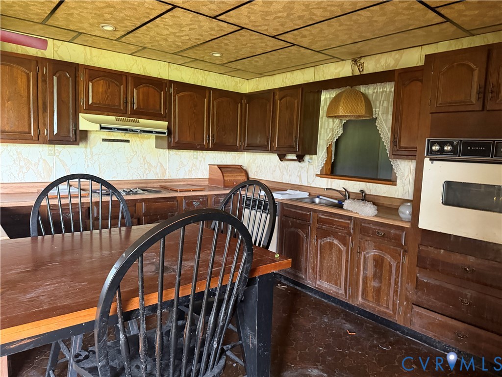 6509 Hines Road Disputanta, VA 23842 - Photo 21 of 22 Kitchen featuring wood cabinetry, wood-finish coun