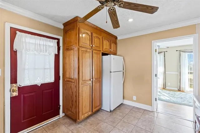 a view of a hallway with closet and a mirror