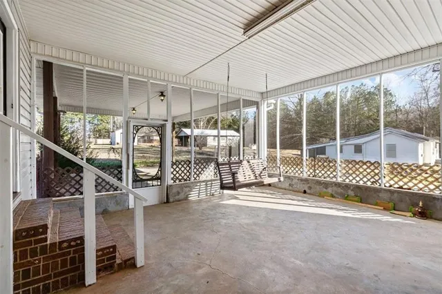 a view of a room with wooden walls