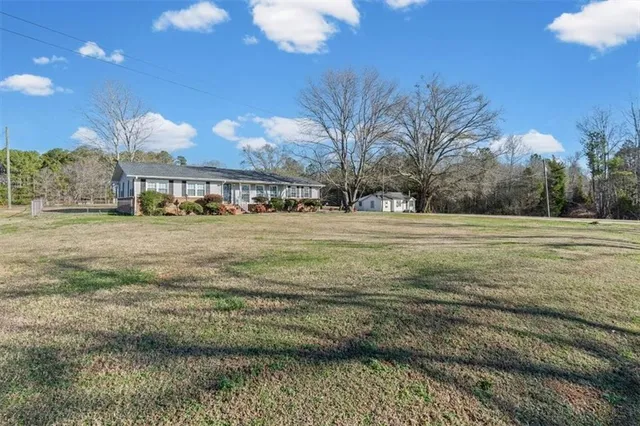 a view of a swimming pool with an outdoor space and seating area