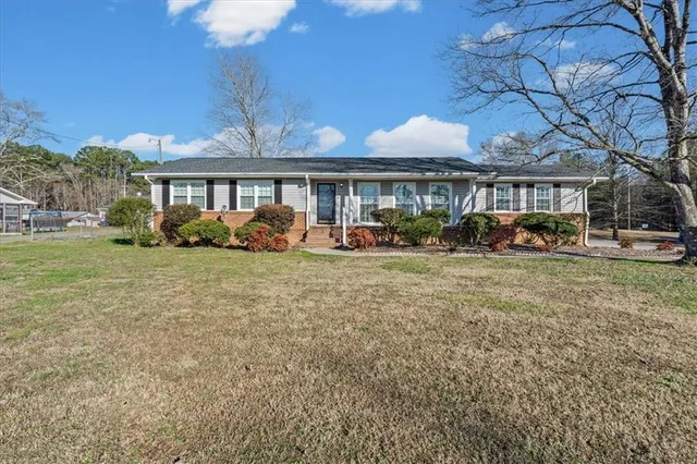 a front view of a house with garden