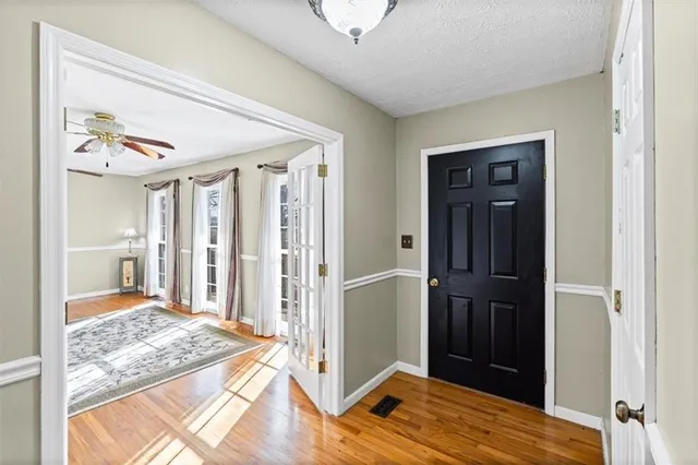 a view of a bedroom with wooden floor and bedroom view