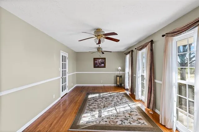a bedroom with bed and a chandelier