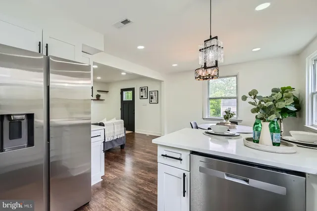 a kitchen with a refrigerator and countertop