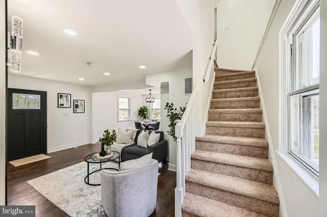 a view of a living room and entryway