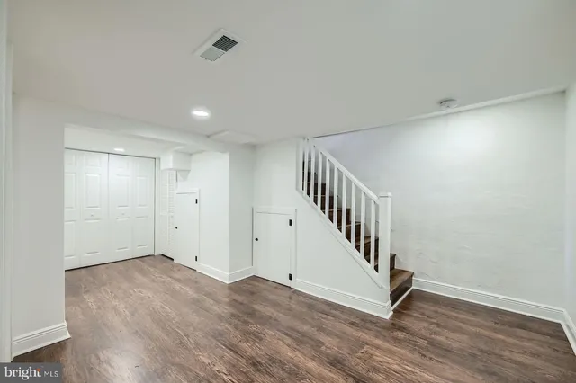 a view of an entryway with wooden floor
