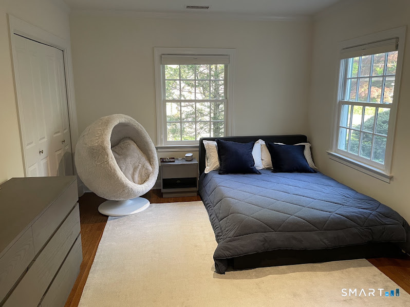 9 Tory Hole Road Darien, CT 06820 - Photo 21 of 33 a bedroom with a bed and window