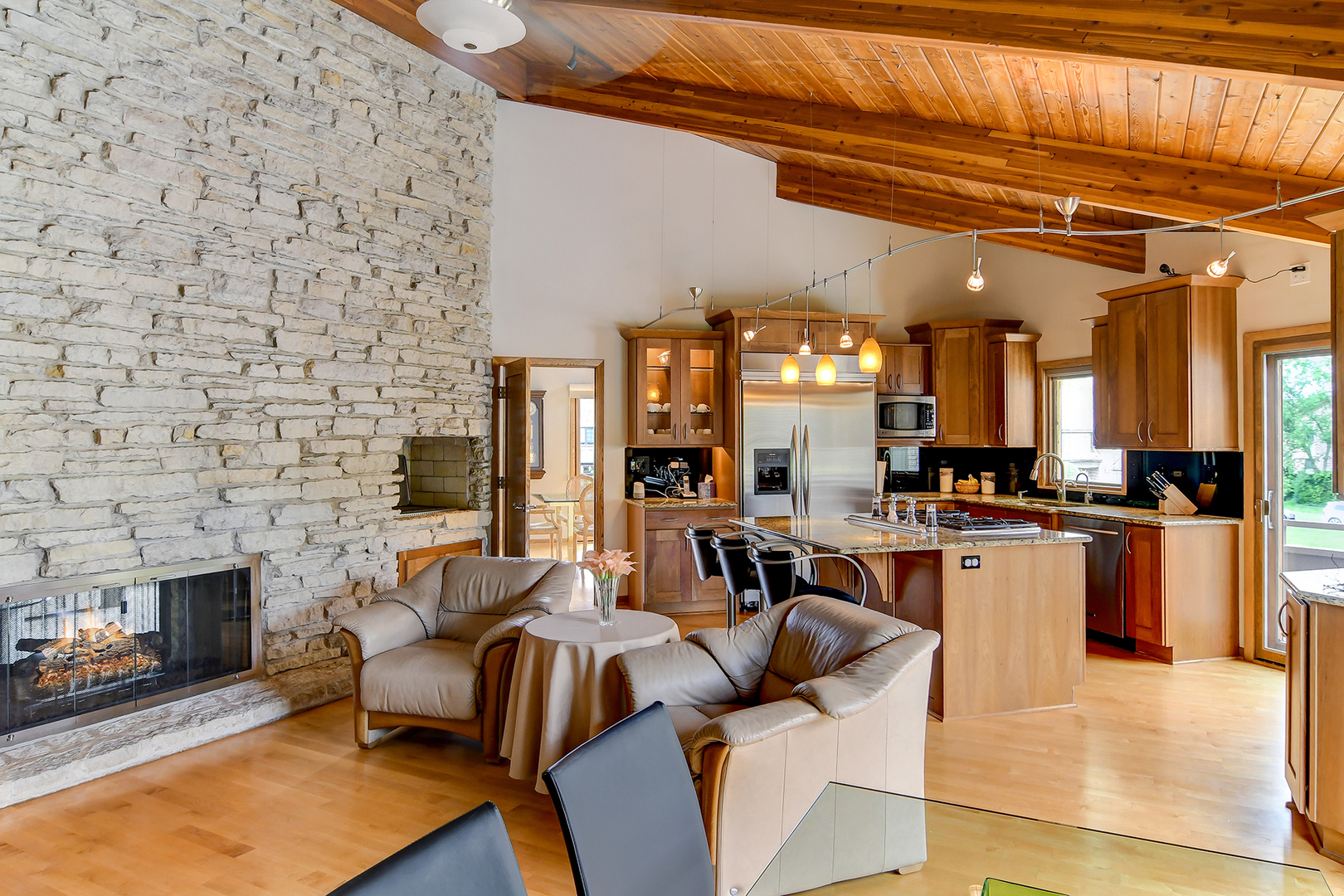 39 Fawn Court Burr Ridge, IL 60527 - Photo 12 of 46 a view of a living room kitchen with furniture and a fireplace