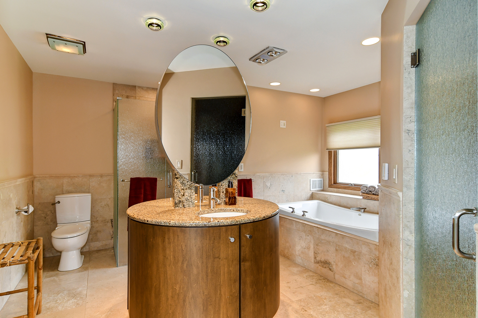 39 Fawn Court Burr Ridge, IL 60527 - Photo 18 of 46 a bathroom with a sink a toilet and a mirror