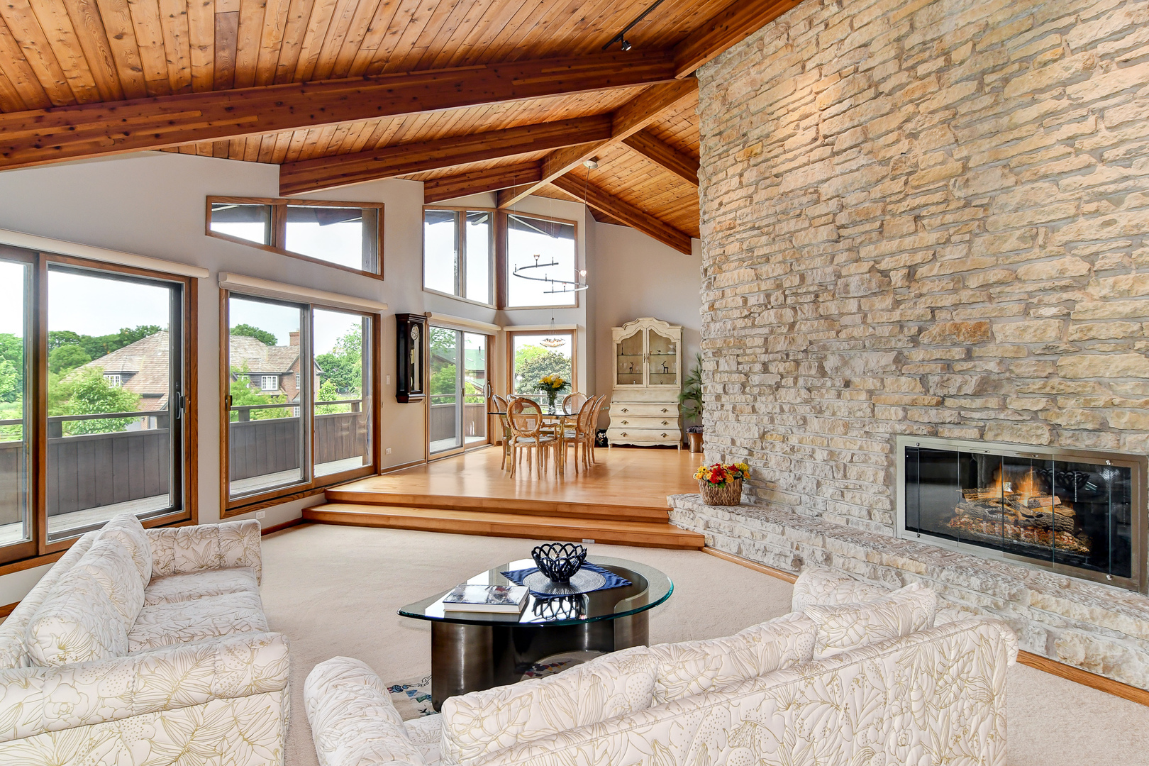 39 Fawn Court Burr Ridge, IL 60527 - Photo 6 of 46 a living room with furniture large windows and a fireplace