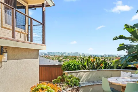 a kitchen with sink a refrigerator and cabinets