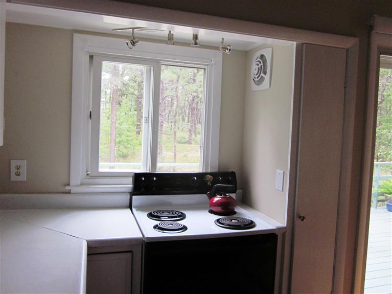 151 Cove View Road Wellfleet, MA 02667 - Photo 8 of 32 a view of a room that has a window and a table in it