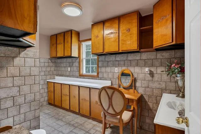a view of a bathroom with a sink and a window