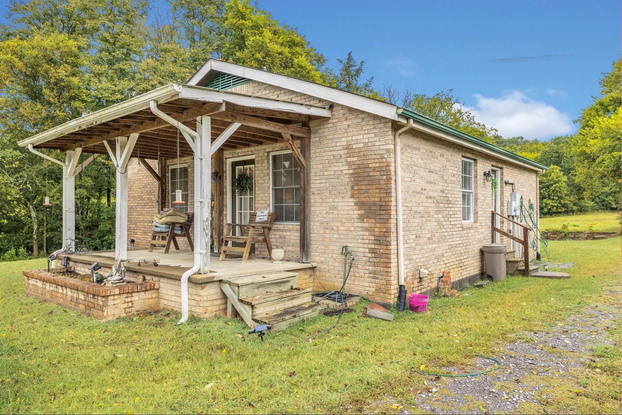 6845 Bizzell Howell Road College Grove, TN 37046 - Photo 3 of 20 a front view of a house with garden