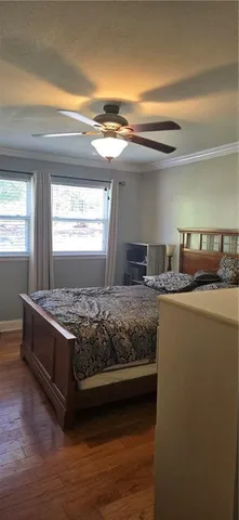 a bed room with a bed and a window