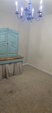 a wooden bench sitting in front of a house