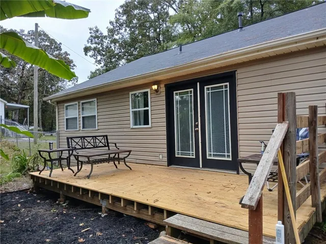a view of a chairs and table in the patio
