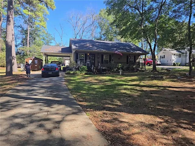 a view of a town with brick building and large trees