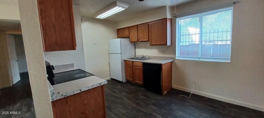 2537 West Georgia Avenue, Unit 2 Phoenix, AZ 85017 - Photo 6 of 14 a kitchen with a sink window and cabinets